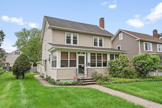 323 Hooker Ave, Poughkeepsie, NY 12603 - view of front of property with a front lawn, a chimney, and a shingled roof