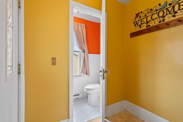 323 Hooker Ave, Poughkeepsie, NY 12603 - bathroom featuring toilet, baseboard heating, and tile patterned floors