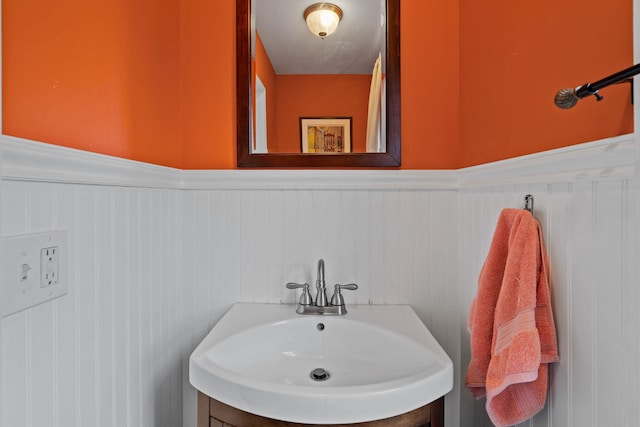 323 Hooker Ave, Poughkeepsie, NY 12603 - bathroom featuring a sink and wainscoting