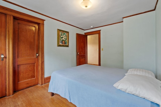 323 Hooker Ave, Poughkeepsie, NY 12603 - bedroom featuring light wood-style floors and ornamental molding