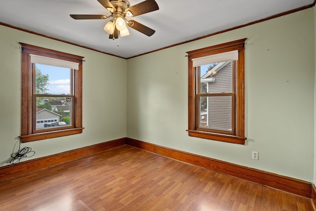 323 Hooker Ave, Poughkeepsie, NY 12603 - empty room with wood finished floors, baseboards, crown molding, and ceiling fan