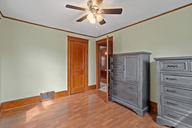 323 Hooker Ave, Poughkeepsie, NY 12603 - unfurnished bedroom featuring light wood-style flooring, ornamental molding, baseboards, and ceiling fan