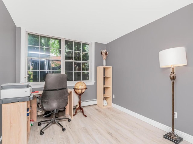 117 Sunset Blvd Unit 10117, Bronx, NY 10473 - office area with wood finished floors, baseboards, and a baseboard heating unit