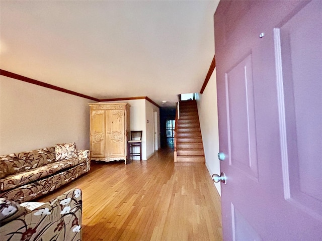 2813 W 30th St, Brooklyn, NY 11224 - entrance foyer featuring ornamental molding, light wood-style flooring, and stairs