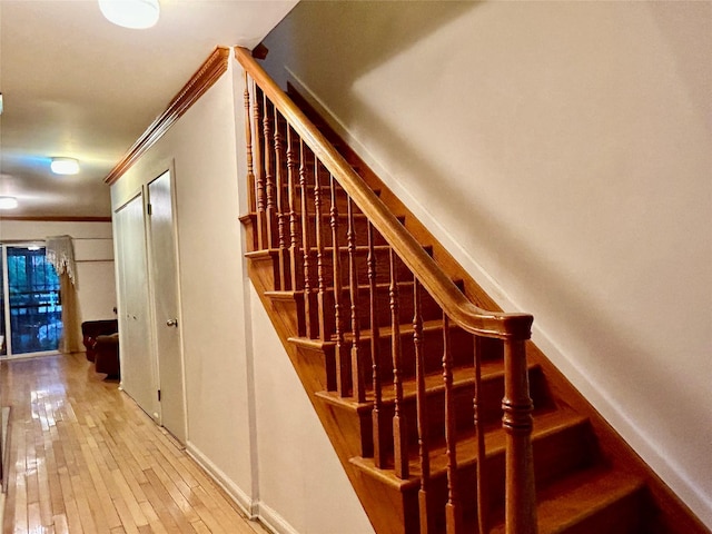 2813 W 30th St, Brooklyn, NY 11224 - stairway with baseboards, ornamental molding, and hardwood / wood-style floors