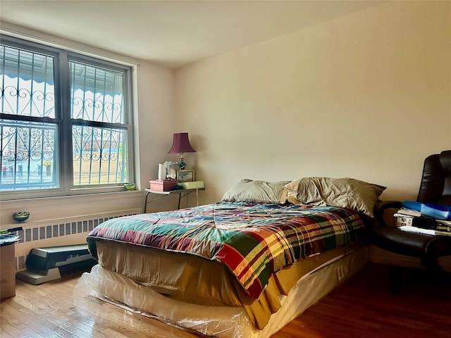 2813 W 30th St, Brooklyn, NY 11224 - bedroom with hardwood / wood-style flooring and radiator heating unit
