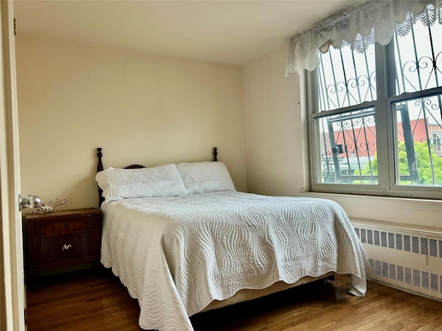 2813 W 30th St, Brooklyn, NY 11224 - bedroom with radiator heating unit and wood finished floors