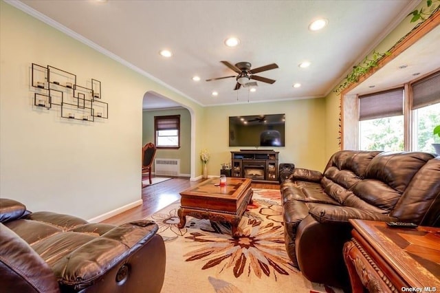 252-14 82nd Rd, Bellerose, NY 11426 - living area featuring radiator, arched walkways, recessed lighting, wood finished floors, and baseboards