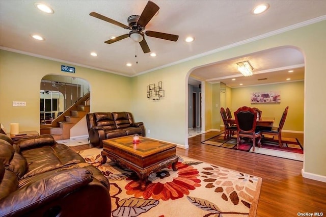 252-14 82nd Rd, Bellerose, NY 11426 - living area with arched walkways, recessed lighting, wood finished floors, a ceiling fan, and baseboards