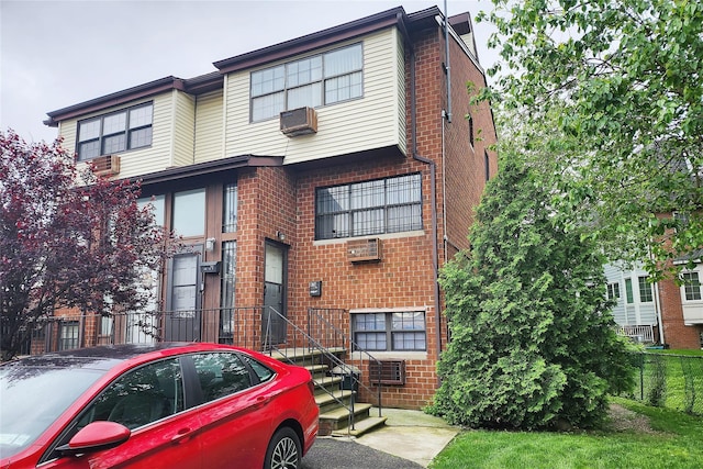 120-16 Cove Ct Unit 87A, College Point, NY 11356 - multi unit property with brick siding, a wall unit AC, and cooling unit