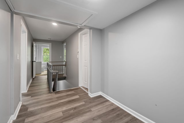 7 Grant St, Poughkeepsie, NY 12601 - hallway with attic access, wood finished floors, baseboards, an upstairs landing, and recessed lighting