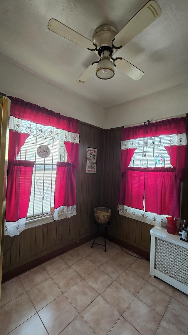 11419 179th St, Addisleigh Park, NY 11434 - tiled empty room with ceiling fan and wood walls