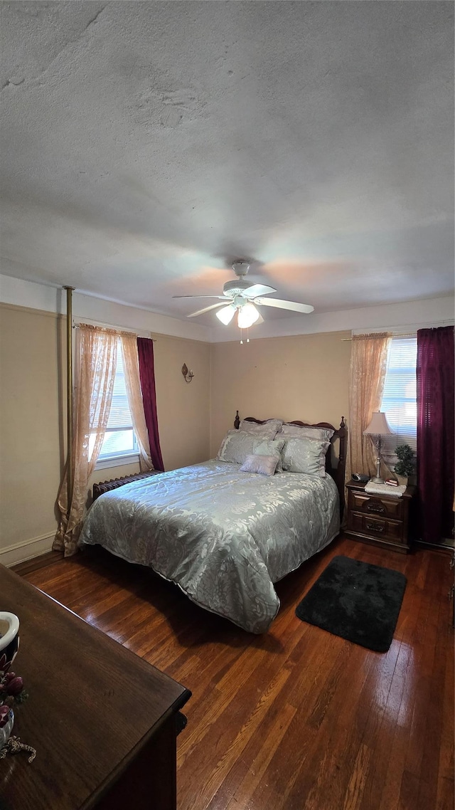 11419 179th St, Addisleigh Park, NY 11434 - bedroom featuring hardwood / wood-style flooring, multiple windows, a ceiling fan, and a textured ceiling
