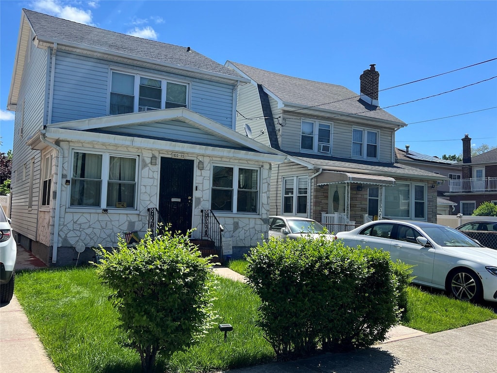 109-15 210th St, Queens Village, NY 11429 - view of front facade with a chimney and stone siding