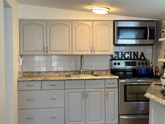 214SHOREDRIVE Shore Dr, Brewster, NY 10509 - kitchen featuring stainless steel appliances, a sink, and decorative backsplash