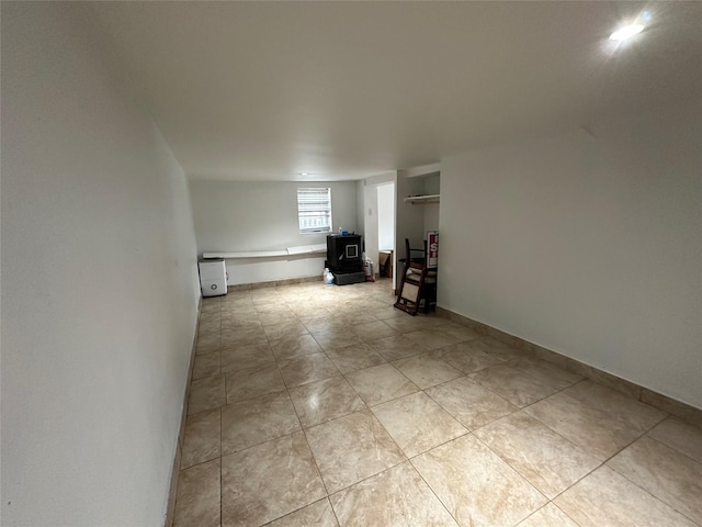 214SHOREDRIVE Shore Dr, Brewster, NY 10509 - living room with light tile patterned floors and a wood stove