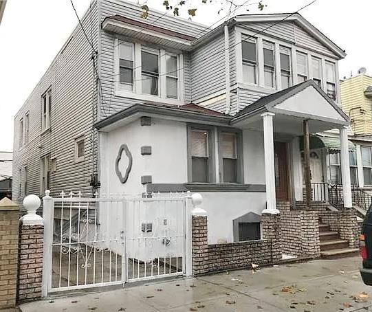 18 Sheridan Ave, Brooklyn, NY 11208 - multi unit property featuring stucco siding and a gate