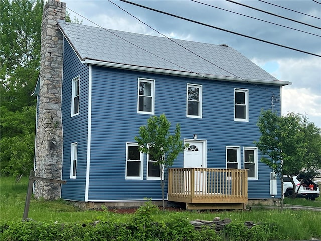 692 Burlingham Rd, Bloomingburg, NY 12721 - rear view of house featuring a chimney and a deck
