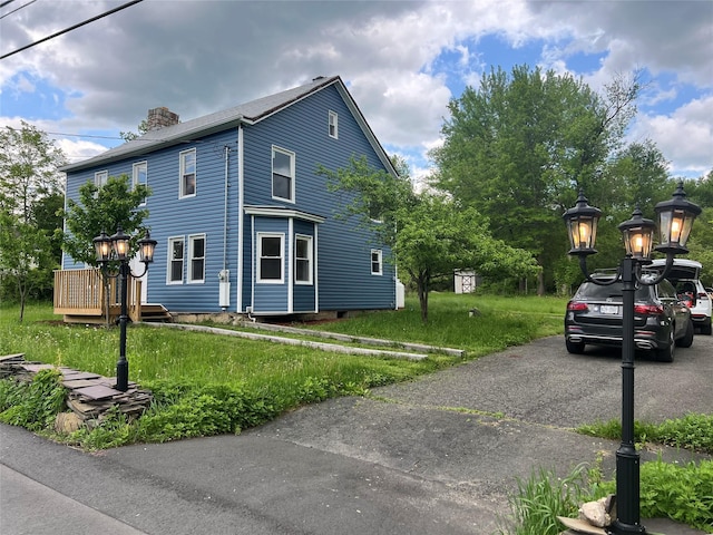 692 Burlingham Rd, Bloomingburg, NY 12721 - view of property exterior featuring a chimney