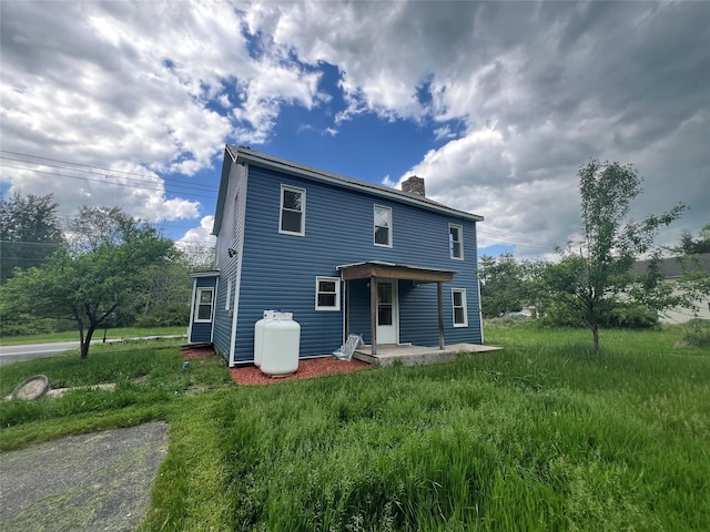 692 Burlingham Rd, Bloomingburg, NY 12721 - back of house with a chimney