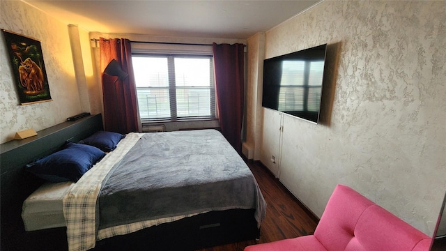 bedroom featuring wood finished floors