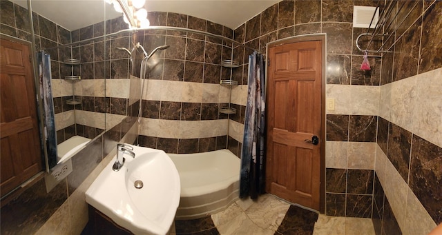 2944 W 5th St Unit 15S, Brooklyn, NY 11224 - bathroom with shower / bath combination with curtain, marble finish flooring, and tile walls