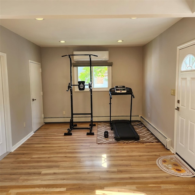 47 Barnum Ave, Plainview, NY 11803 - exercise area with a wall mounted AC, a baseboard radiator, healthy amount of natural light, light wood-style floors, and recessed lighting