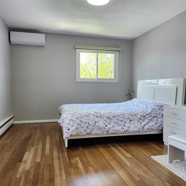 47 Barnum Ave, Plainview, NY 11803 - bedroom with a wall unit AC, hardwood / wood-style floors, a baseboard radiator, and baseboards