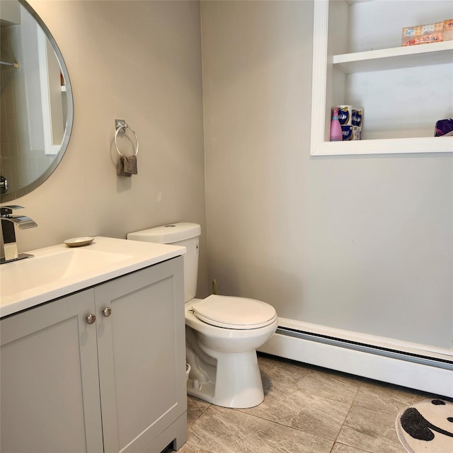 47 Barnum Ave, Plainview, NY 11803 - bathroom with baseboard heating, toilet, vanity, and tile patterned flooring
