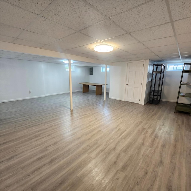 47 Barnum Ave, Plainview, NY 11803 - basement featuring baseboards, wood finished floors, and a paneled ceiling