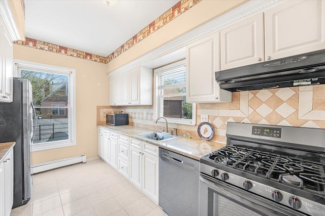 1465 Mayflower Ave, Bronx, NY 10461 - kitchen featuring stainless steel appliances, a sink, baseboard heating, ventilation hood, and backsplash