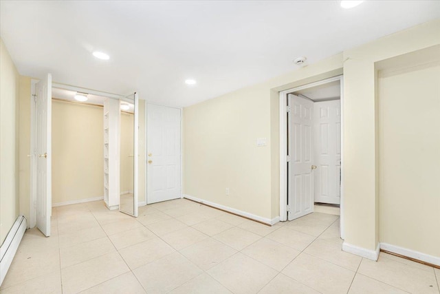 1465 Mayflower Ave, Bronx, NY 10461 - unfurnished bedroom with a baseboard heating unit, light tile patterned floors, baseboards, and recessed lighting