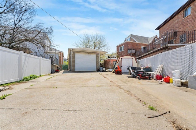 1465 Mayflower Ave, Bronx, NY 10461 - detached garage with concrete driveway, fence, and a residential view