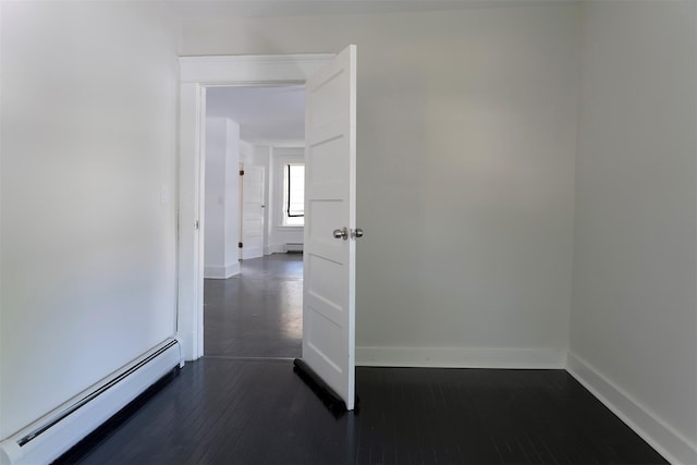 17 Washington Ave, Millbrook, NY 12545 - unfurnished room featuring a baseboard radiator, baseboards, dark wood finished floors, and a baseboard heating unit