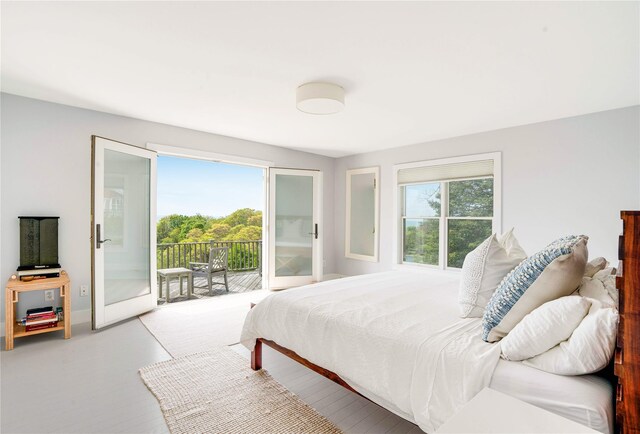 6 Beech Hollow Ct, Montauk, NY 11954 - bedroom with access to outside and baseboards
