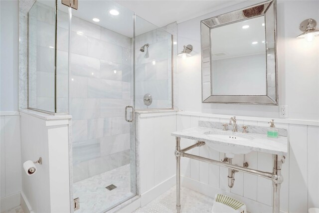 6 Beech Hollow Ct, Montauk, NY 11954 - full bathroom with a stall shower, a wainscoted wall, a sink, and recessed lighting