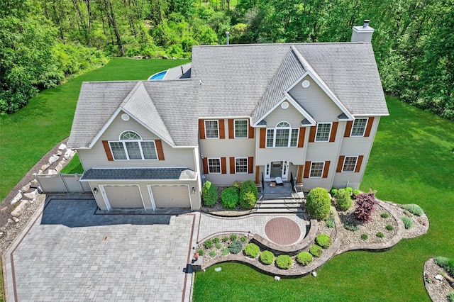 7 Stonewall Ct, Warwick, NY 10990 - view of front of house featuring a garage, decorative driveway, a chimney, and a shingled roof