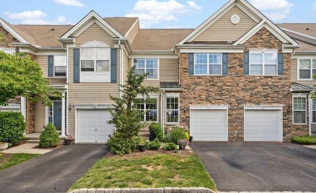 5 Case Ct, Monroe, NY 10950 - view of property with driveway, a garage, and stone siding