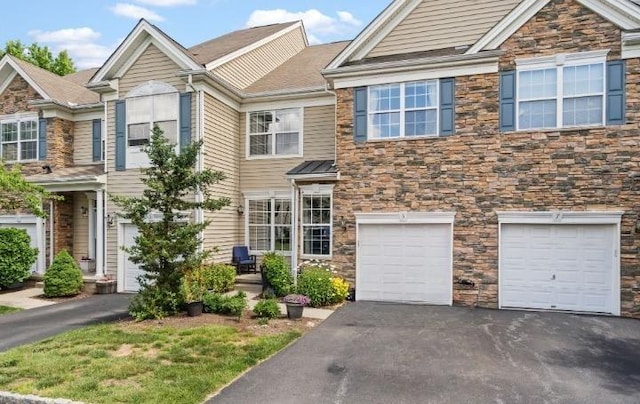 5 Case Ct, Monroe, NY 10950 - multi unit property with stone siding, asphalt driveway, and an attached garage