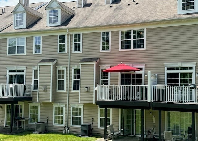 5 Case Ct, Monroe, NY 10950 - back of house with central air condition unit and a chimney