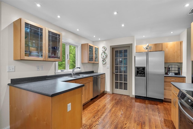5 Gabriels Dr, Chester, NY 10918 - kitchen with stainless steel appliances, a sink, dark countertops, wood finished floors, and glass insert cabinets