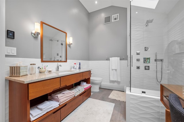 5 Gabriels Dr, Chester, NY 10918 - full bath with tile walls, a walk in shower, vanity, toilet, and vaulted ceiling