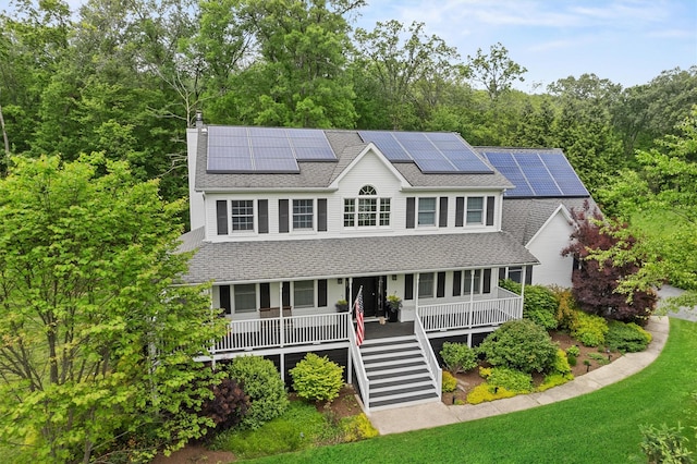 5 Gabriels Dr, Chester, NY 10918 - view of front of property featuring a shingled roof, covered porch, stairs, a chimney, and roof mounted solar panels