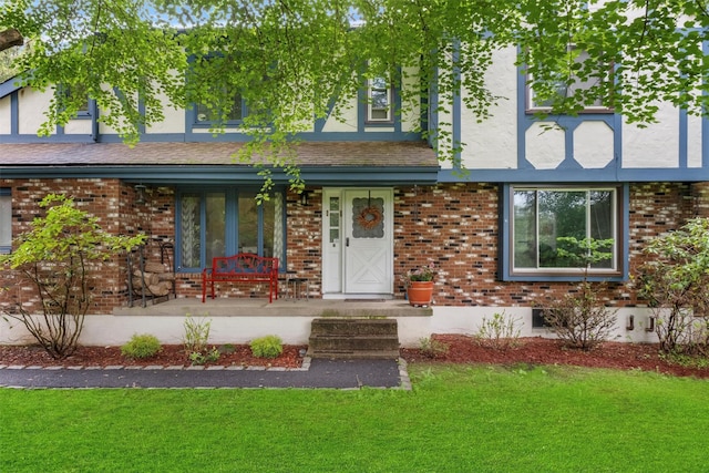 3 Sebastian Ct, Hopewell Junction, NY 12533 - tudor house with a front lawn, covered porch, and brick siding