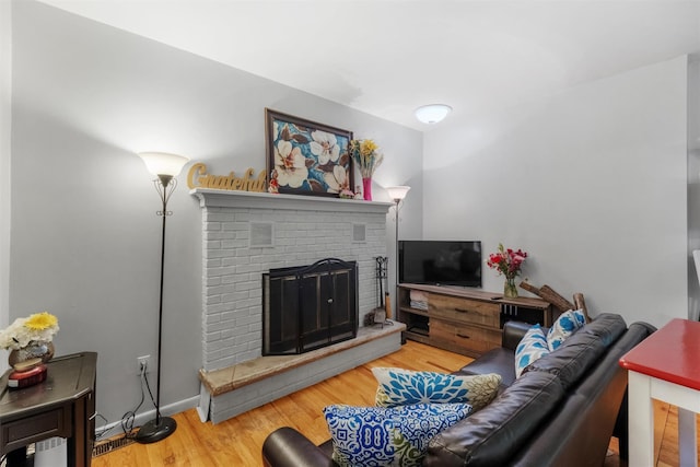 3 Sebastian Ct, Hopewell Junction, NY 12533 - living area featuring wood finished floors and a brick fireplace