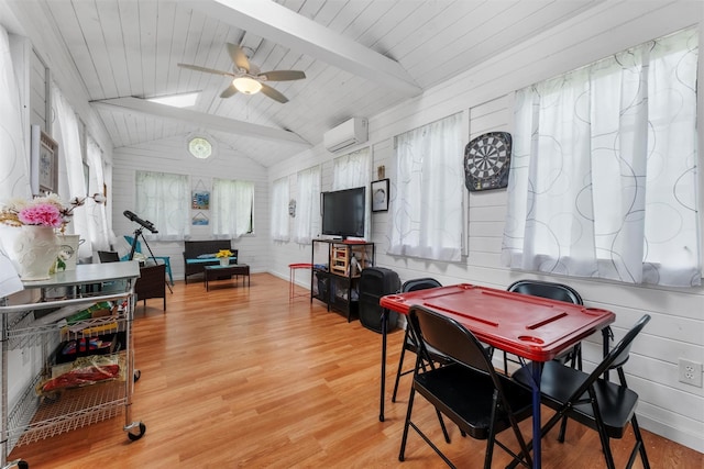 3 Sebastian Ct, Hopewell Junction, NY 12533 - dining room featuring a wall unit AC, ceiling fan, wood finished floors, and wooden walls