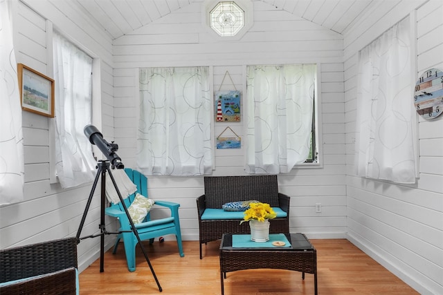 3 Sebastian Ct, Hopewell Junction, NY 12533 - sitting room with vaulted ceiling, wood finished floors, baseboards, and wood walls