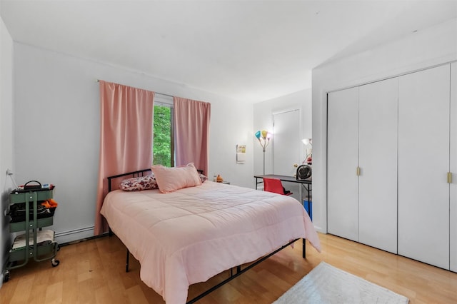 3 Sebastian Ct, Hopewell Junction, NY 12533 - bedroom with a baseboard radiator, light wood-style flooring, and a closet