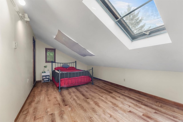 3 Sebastian Ct, Hopewell Junction, NY 12533 - bedroom with a skylight, wood finished floors, vaulted ceiling, and baseboards