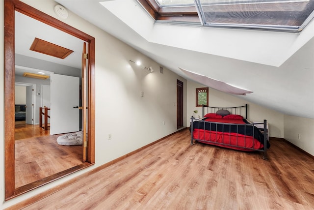 3 Sebastian Ct, Hopewell Junction, NY 12533 - bedroom featuring wood finished floors, a skylight, baseboards, and vaulted ceiling